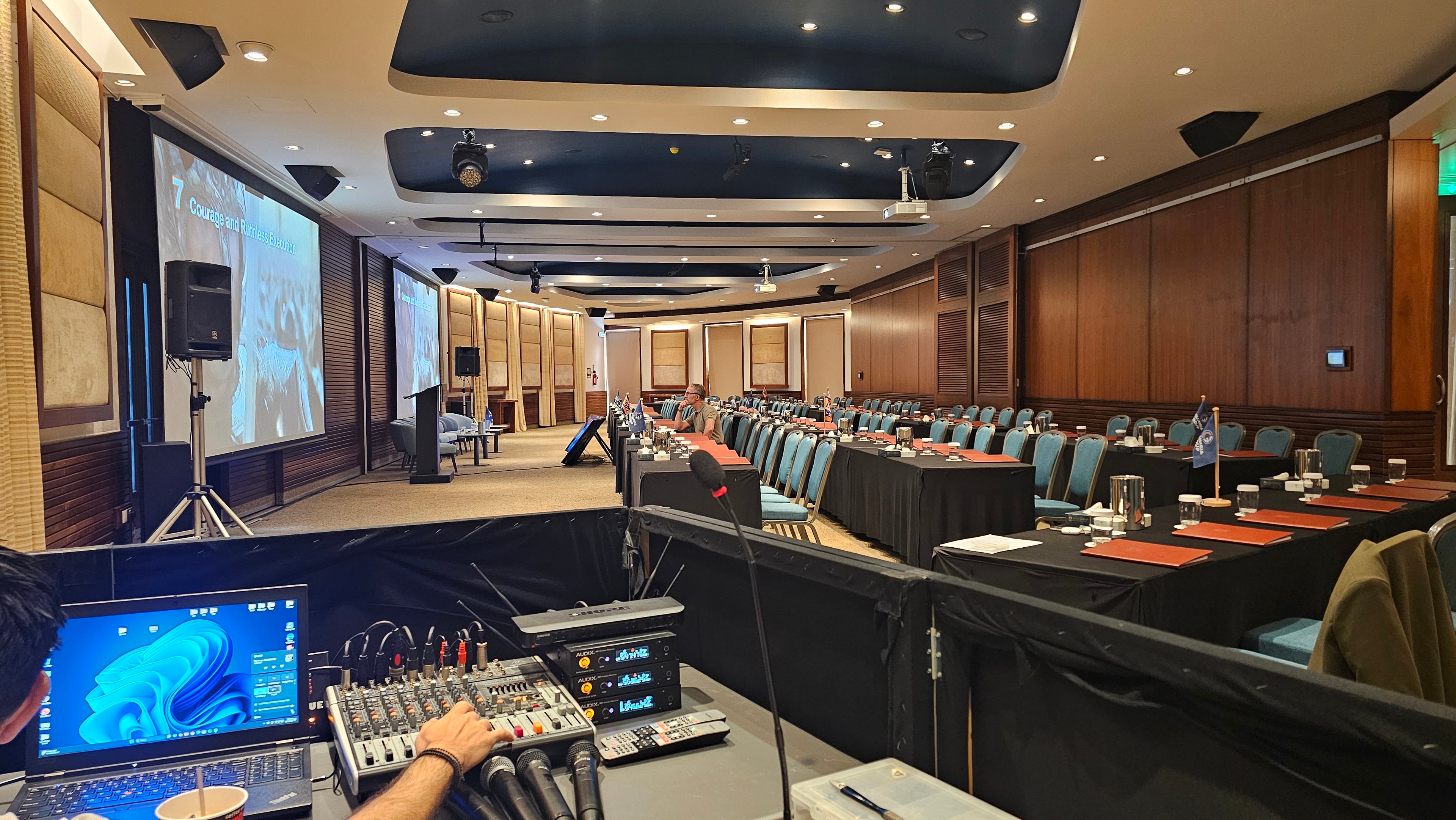 Conference room audiovisual setup viewed from the sound mixing position