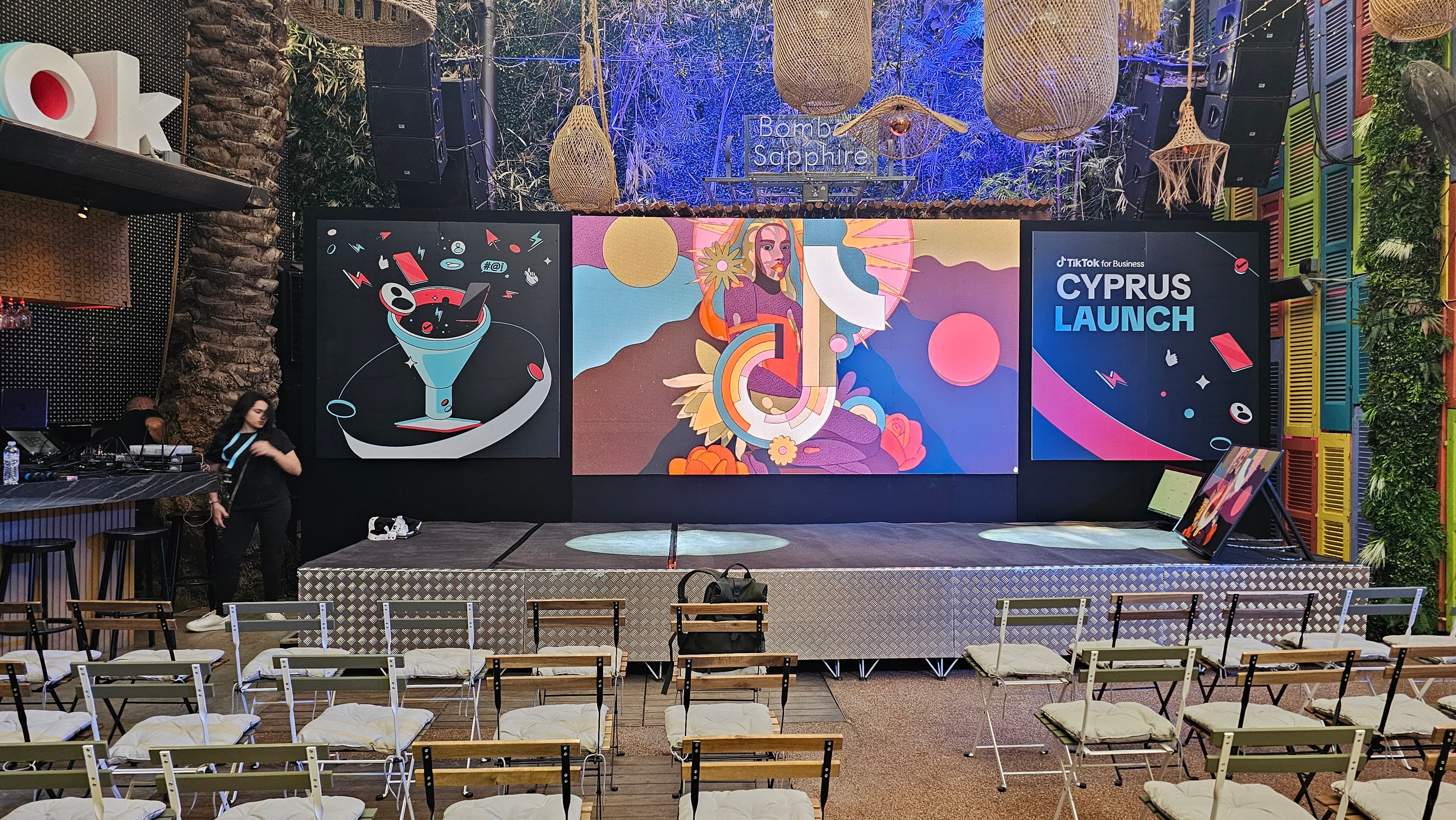 TikTok Cyprus launch stage with LED displays and event seating