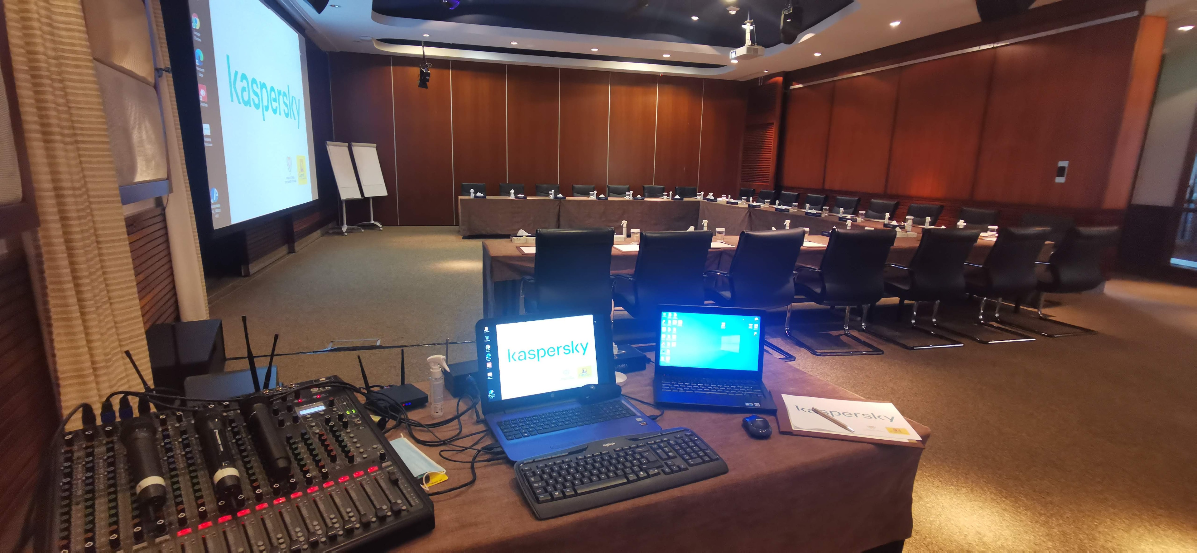 Audio mixer and presentation laptops overlooking the meeting room