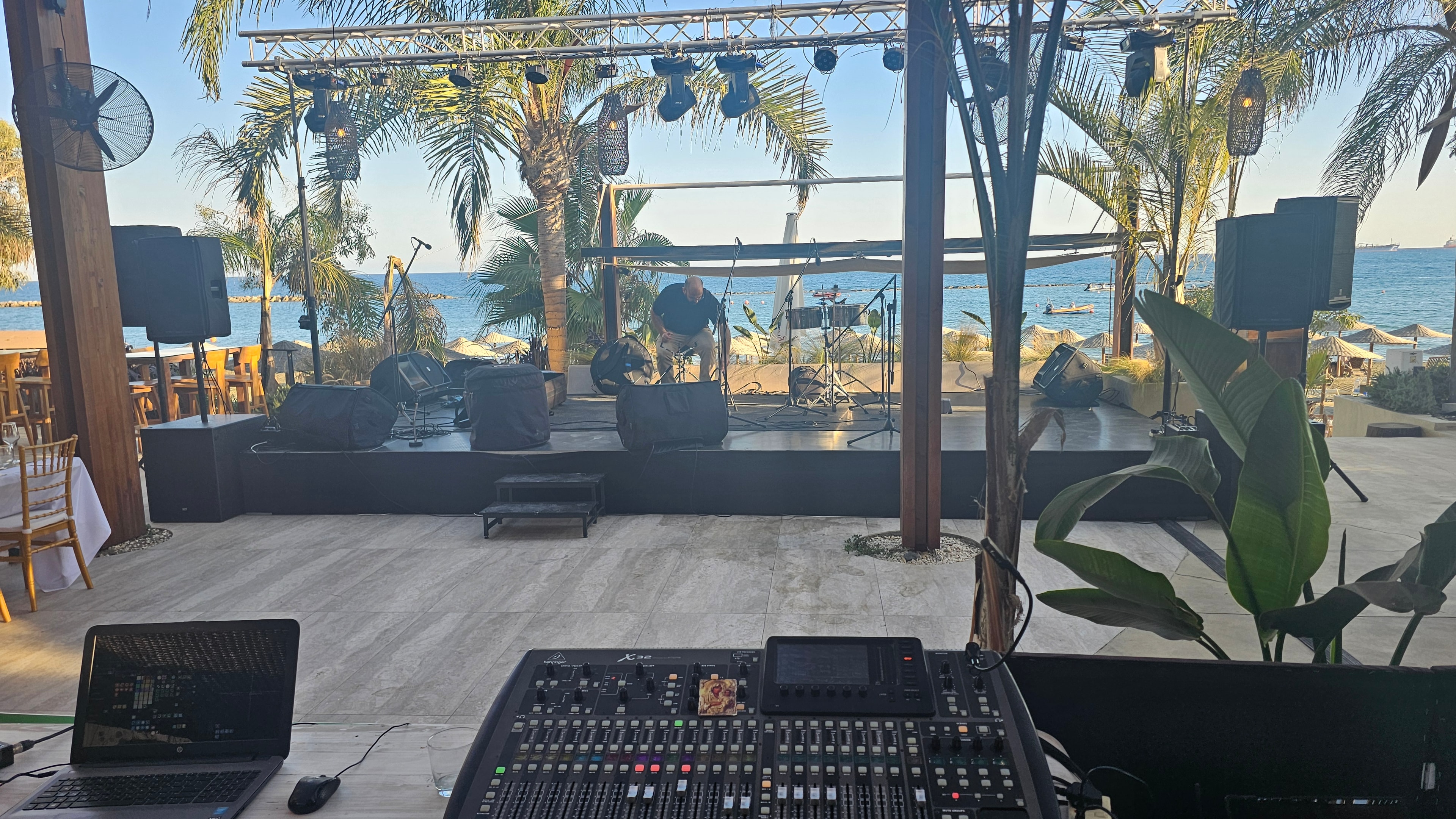 Live-sound control position beside the beachside stage